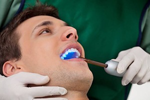 A man receiving dental bonding.