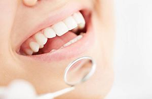 A closeup of a patient’s mouth during a checkup.