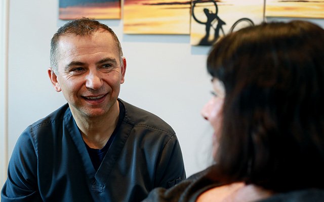 dentist talking to patient